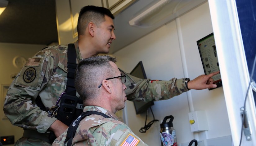 Alaska Air National Guard Capt. Roger Tran, the Nuclear Medical Science Officer for the 103rd Civil Support team, leads the unit in assessing biological hazards at a validation exercise in Anchorage, Aug. 4, 2020. Tran assisted the Alaska State Public Health laboratory during the COVID-19 pandemic. from early June to mid August (U.S. Army National Guard photo by Sgt. Seth LaCount/Released)