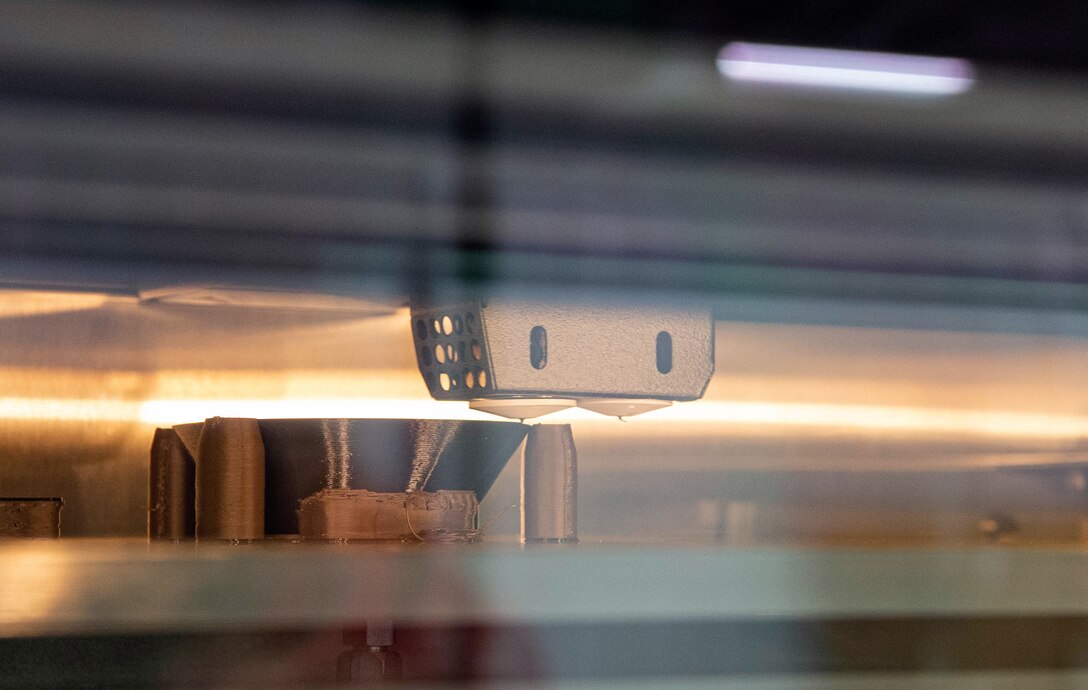 The 62nd Maintenance Squadron (MXS) Metals Technology Shop builds a face mask using a 3D printer at Joint Base Lewis-McChord, Wash., Sept. 9, 2020. The metals technology shop is in the process of using their 3D printer to create facemasks and shields for the 62nd Medical Squadron dental section during COVID-19. (U.S. Air Force photo by Senior Airman Tryphena Mayhugh)