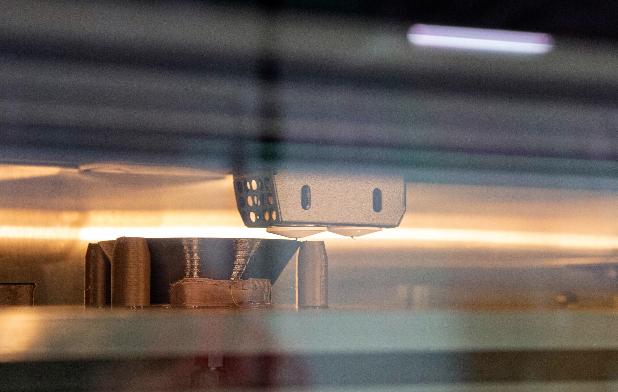 The 62nd Maintenance Squadron (MXS) Metals Technology Shop builds a face mask using a 3D printer at Joint Base Lewis-McChord, Wash., Sept. 9, 2020. The metals technology shop is in the process of using their 3D printer to create facemasks and shields for the 62nd Medical Squadron dental section during COVID-19. (U.S. Air Force photo by Senior Airman Tryphena Mayhugh)