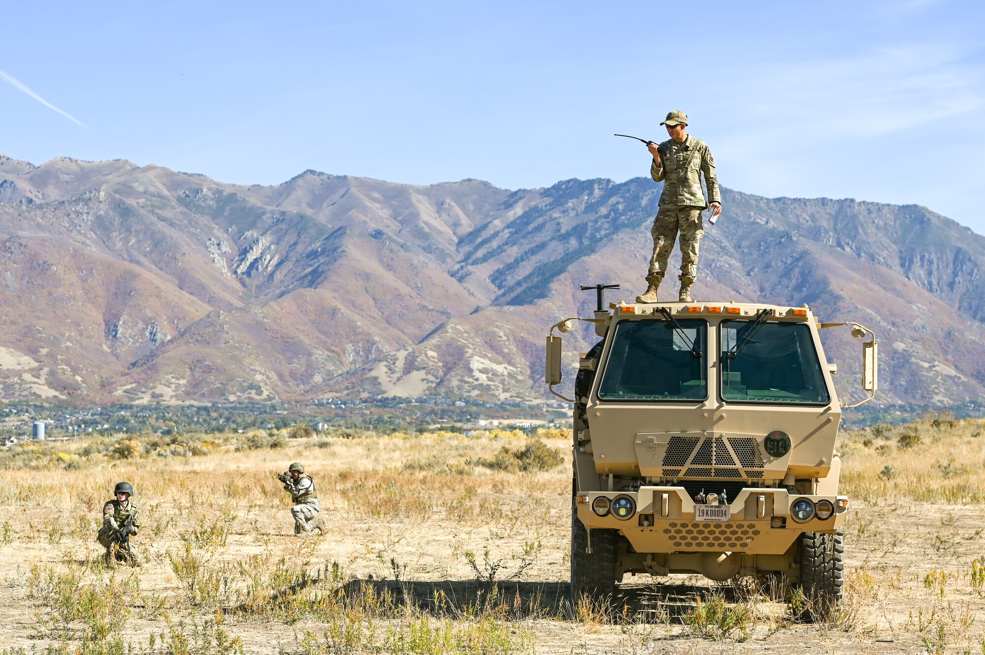 Senior Airman Benjamin Rodriguez, 729th Air Control Squadron, monitors Airmen tactical marching during a Deployment Initial Readiness Training, or DIRT, exercise as part of a simulated defensive scenario Oct. 21, 2020, at Hill Air Force Base, Utah. Airmen from 729th ACS, along with their sister unit 726th ACS from Mountain Home, Idaho, participated in the 48-hour training exercise where they were taught deployment readiness skills. (U.S. Air Force photo by Cynthia Griggs)