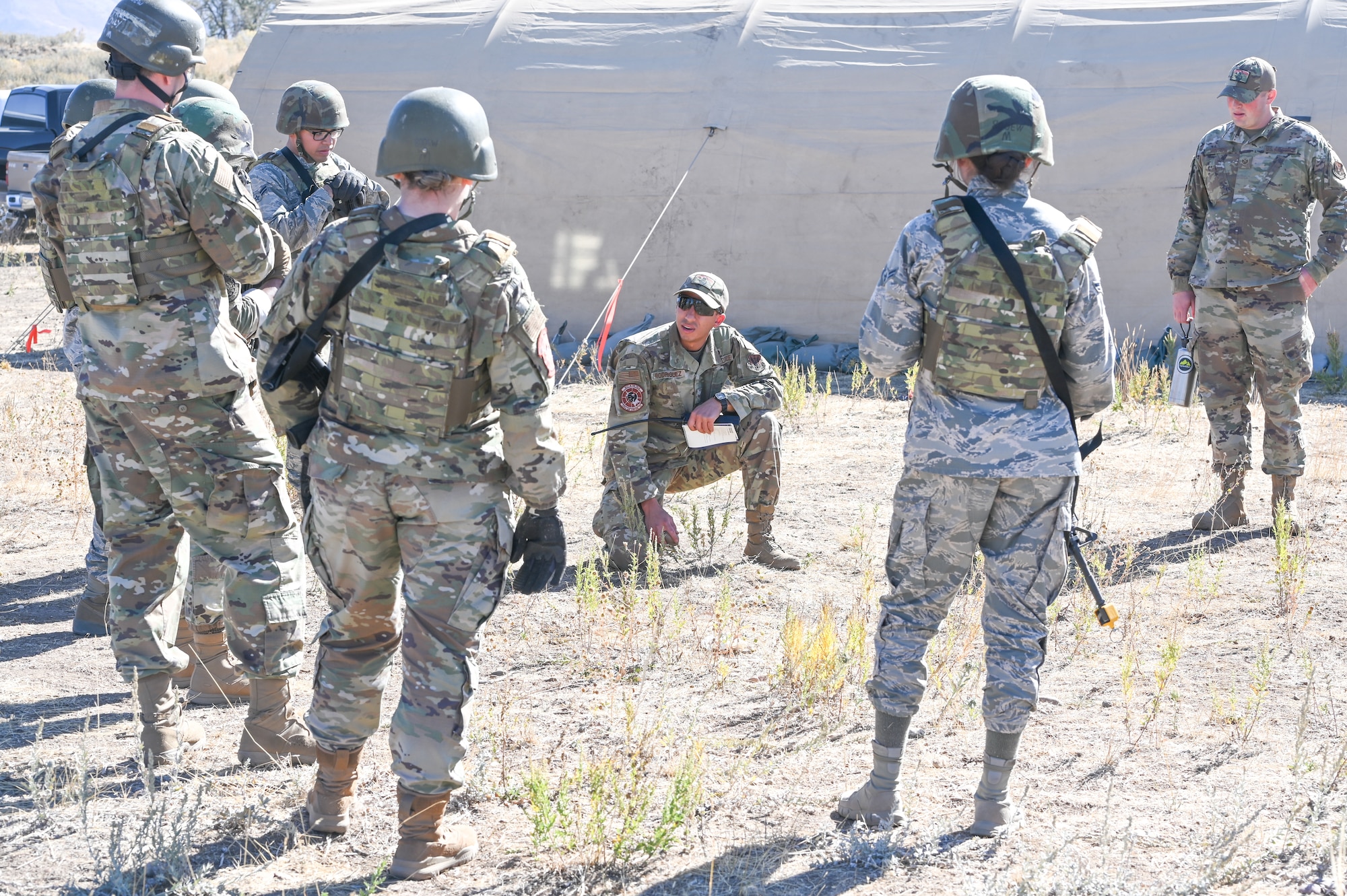 Senior Airman Benjamin Rodriguez, 729th Air Control Squadron, briefs Airmen during a Deployment Initial Readiness Training, or DIRT, exercise as part of a simulated defensive scenario Oct. 21, 2020, at Hill Air Force Base, Utah. Airmen from 729th ACS, along with their sister unit 726th ACS from Mountain Home, Idaho, participated in the 48-hour training exercise where they were taught deployment readiness skills. (U.S. Air Force photo by Cynthia Griggs)