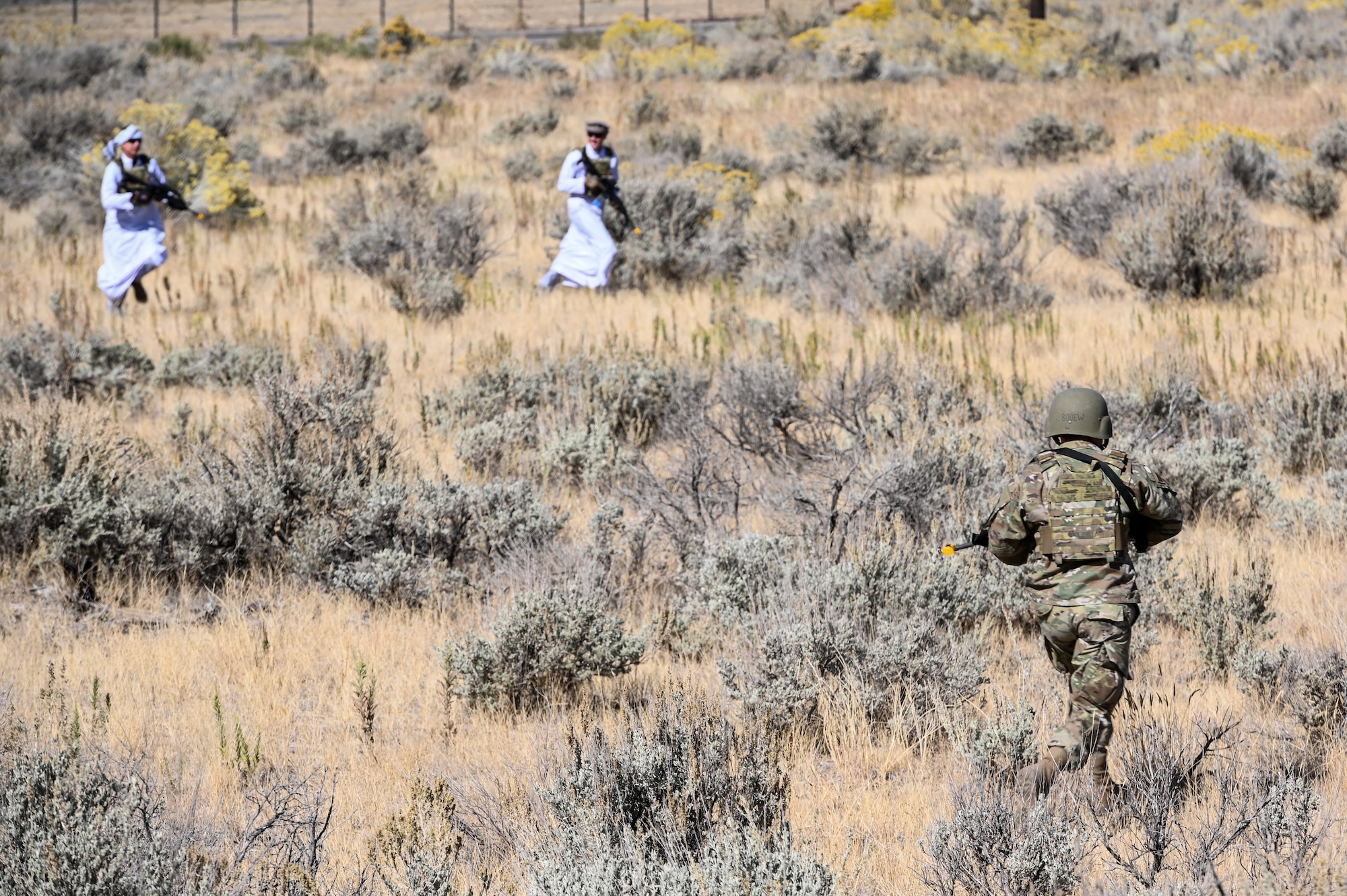 An Airmen chases simulated intruders during a Deployment Initial Readiness Training, or DIRT, exercise Oct. 22, 2020, at Hill Air Force Base, Utah. Airmen from 729th Air Control Squadron, along with their sister unit 726th ACS from Mountain Home, Idaho, participated in the 48-hour training exercise where they were taught deployment readiness skills. (U.S. Air Force photo by Cynthia Griggs)