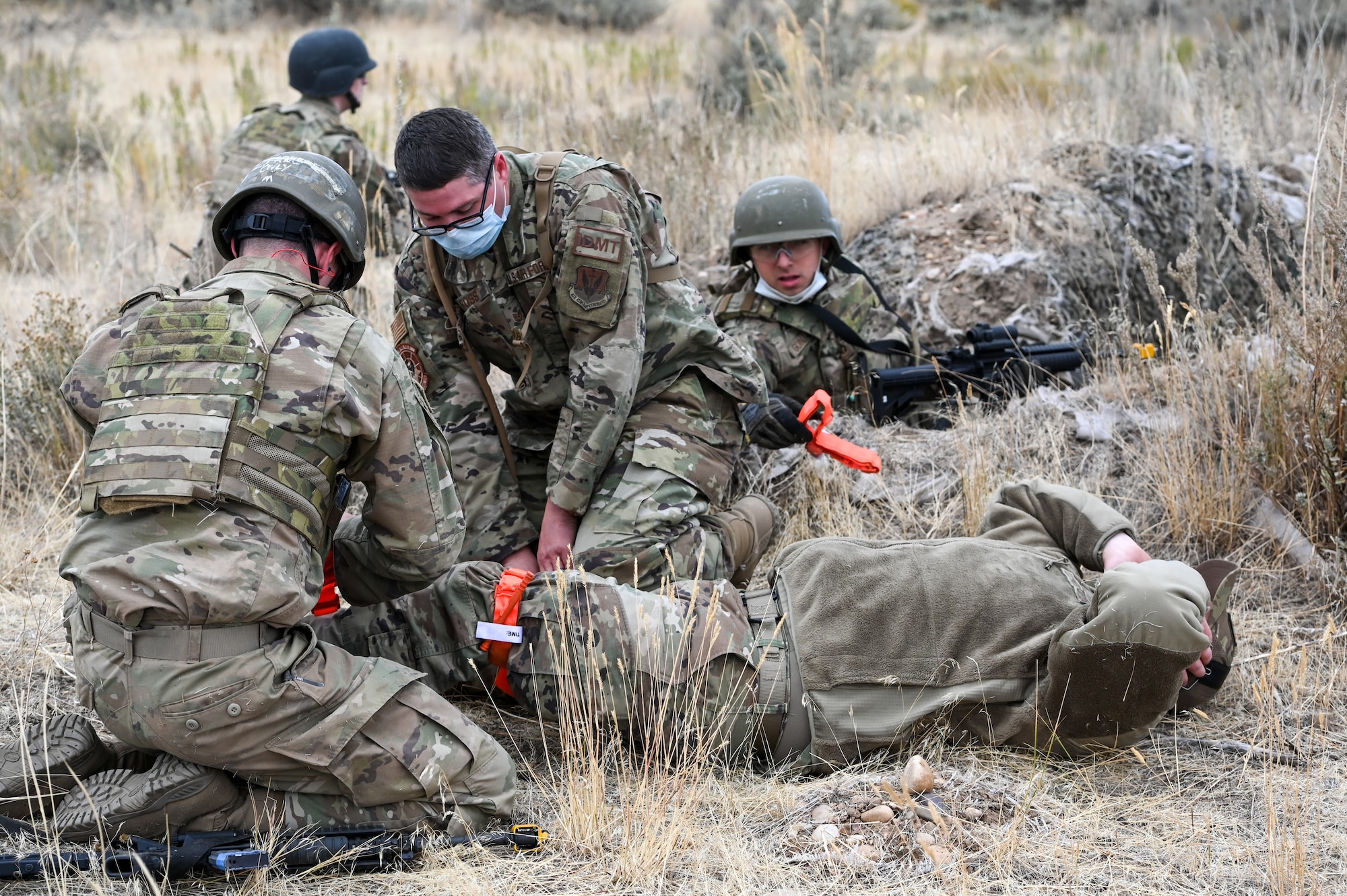 Technical Sgt. Scott Ross (middle), an independent duty medical technician assigned to the 729th Air Control Squadron, teaches care-under-fire procedures during a Deployment Initial Readiness Training, or DIRT, exercise Oct. 22, 2020, at Hill Air Force Base, Utah. Airmen from 729th ACS, along with their sister unit 726th ACS, participated in the 48-hour training exercise where they were taught deployment readiness skills. (U.S. Air Force photo by Cynthia Griggs)