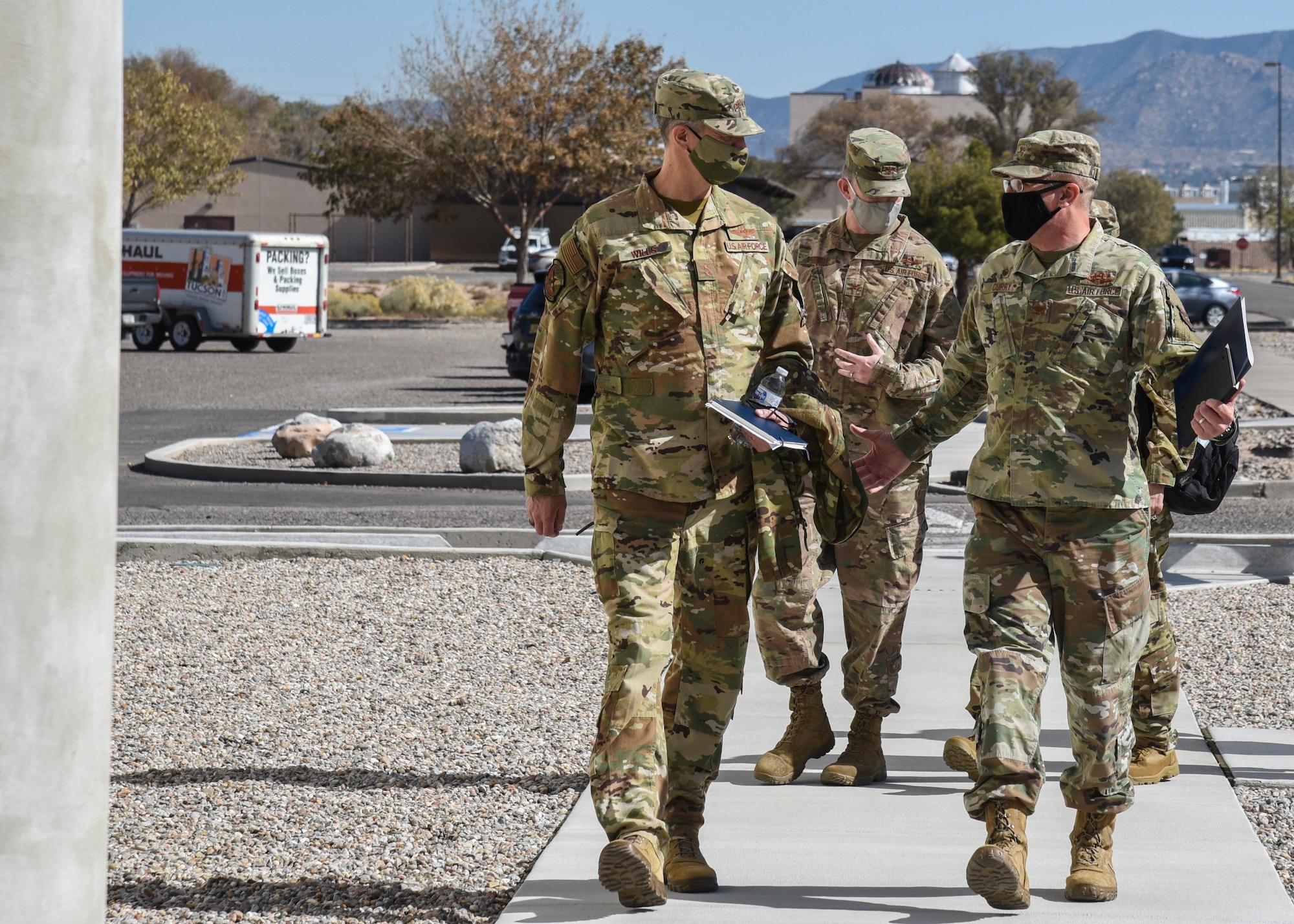 Airmen walking and talking on a tour.