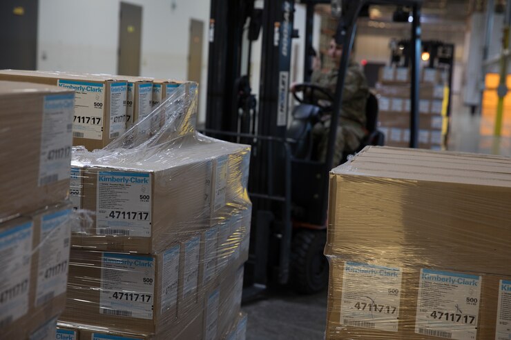 Wilsonville, Ore., March 31, 2020 - Surgical masks are delivered to an Oregon Department of Administrative Services warehouse to help in the response to the COVID-19 pandemic. The masks were provided by Health and Human Services in partnership with FEMA, and received for distribution by the Oregon National Guard and officers from the Oregon Department of Public Safety Standards and Training.   David Yost/FEMA