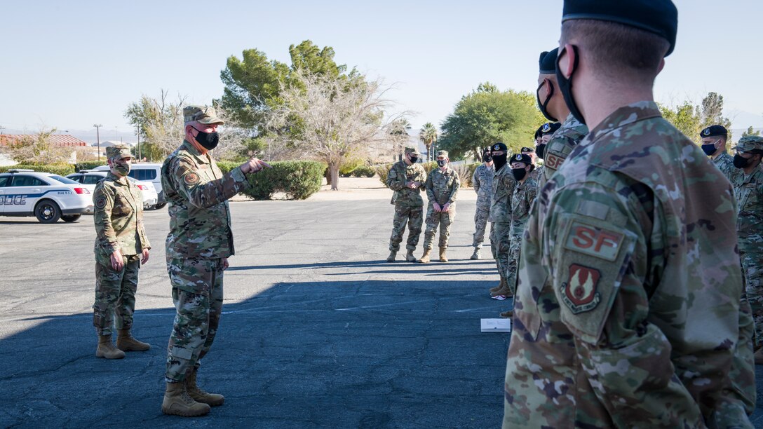 Chaplain (Maj. Gen.) Steven Schaick, Chief of Chaplains, Department of the Air Force, and his Religious Affairs Senior Advisor, Chief Master Sgt. Natalie Gray, offer words of encouragement and appreciation to members of the 412th Security Forces Squadron at Edwards Air Force Base, California, Nov. 4. (Air Force photo by Giancarlo Casem)