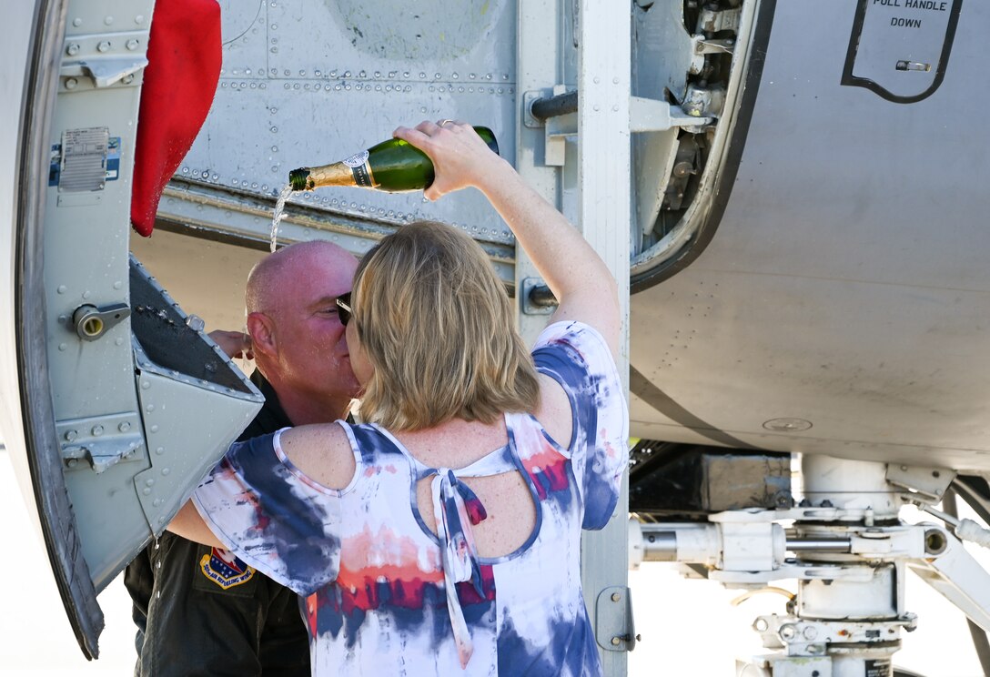 Col. Miles Heaslip, 507th Air Refueling Wing commander, celebrates his final flight with the Okies with his wife Susan Nov. 5, 2020, at Tinker Air Force Base, Oklahoma. (U.S. Air Force photo by Senior Airman Mary Begy)