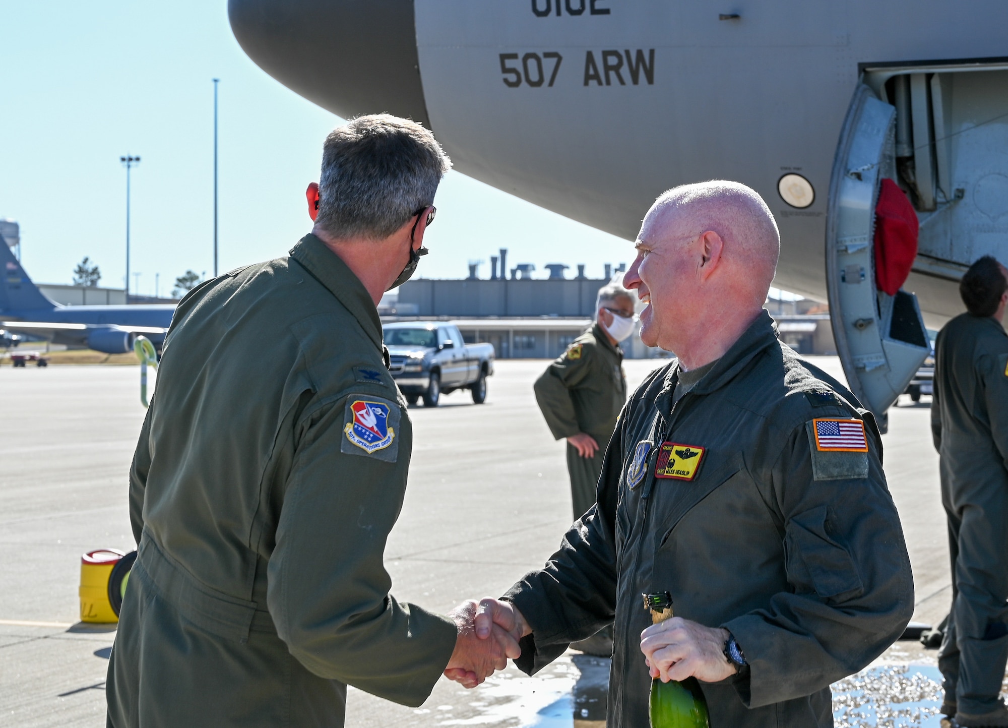 Col. Miles Heaslip, 507th Air Refueling Wing commander, shakes hands with Col. Kenneth Humphrey, 507th Operations Group commander, after his final flight with the Okies on Nov. 5, 2020, at Tinker Air Force Base, Oklahoma. (U.S. Air Force photo by Senior Airman Mary Begy)