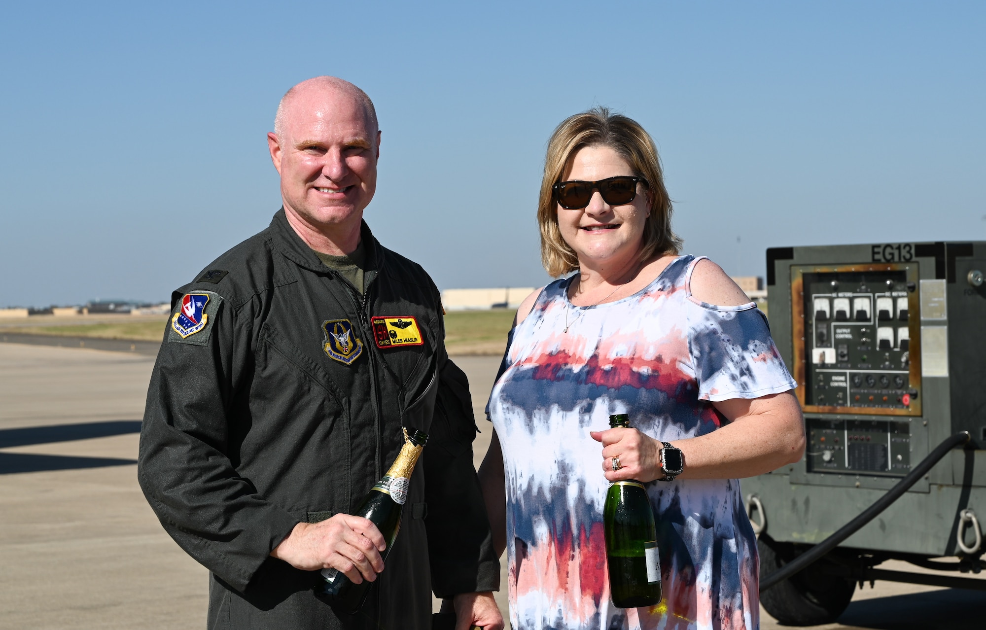 Col. Miles Heaslip, 507th Air Refueling Wing commander, celebrates his final flight with the Okies with his wife Susan Nov. 5, 2020, at Tinker Air Force Base, Oklahoma. (U.S. Air Force photo by Senior Airman Mary Begy)