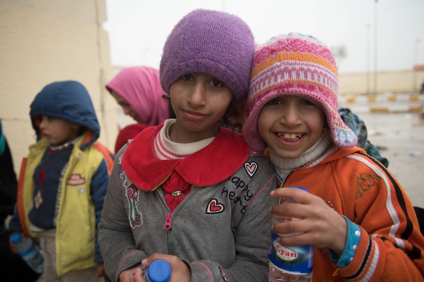 Children pose for a photo.