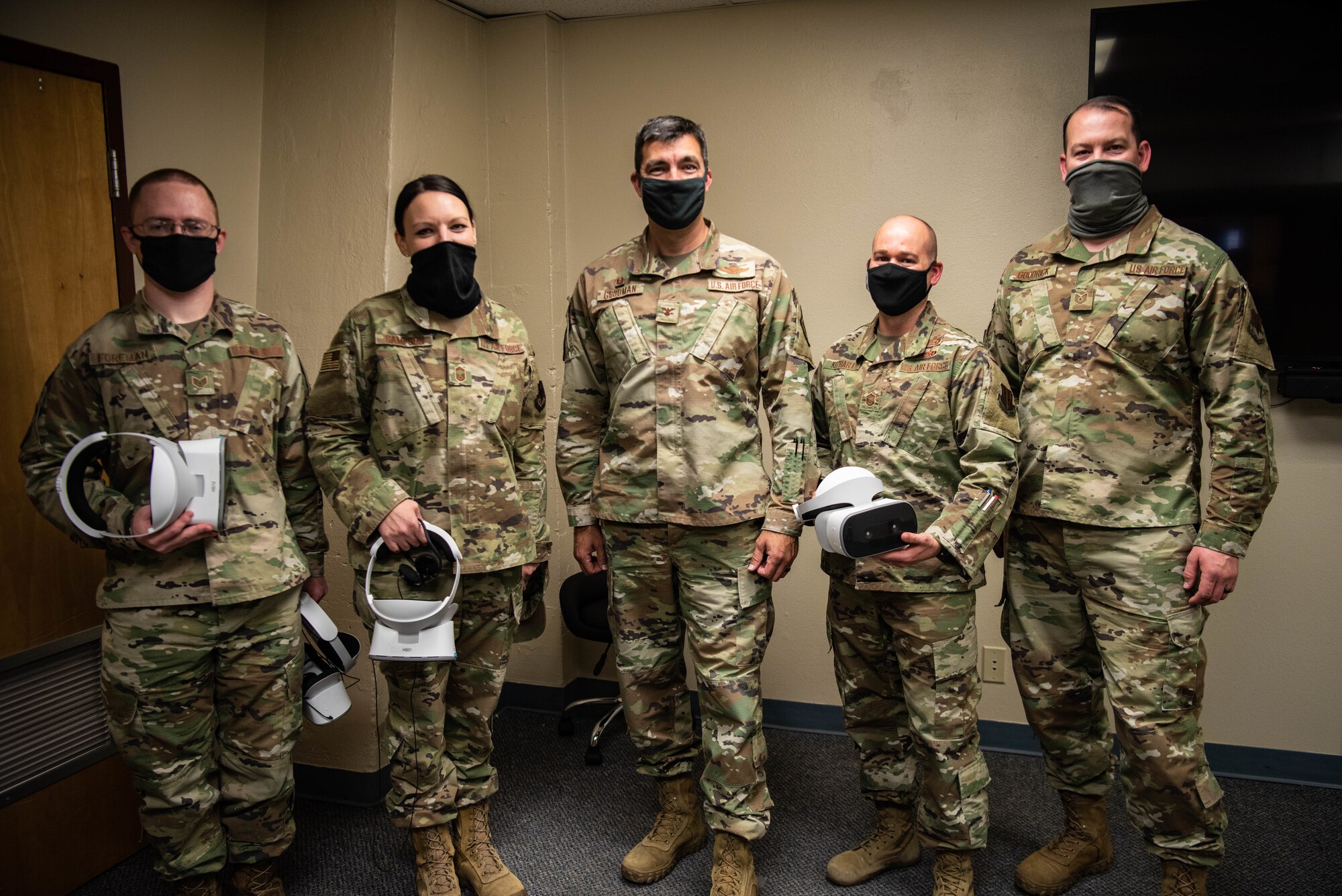 U.S. Air Force Col. Richard A. Goodman, 366th Fighter Wing commander, poses with 366th Operations Support Squadron, on Mountain Home Air Force Base, ID, Nov. 5, 2020. The 366th OSS has integrated virtual reality into their every day operations to help train newer Airmen. (U.S. Air Force photo by Airman 1st Class Cheyenne Bassham)