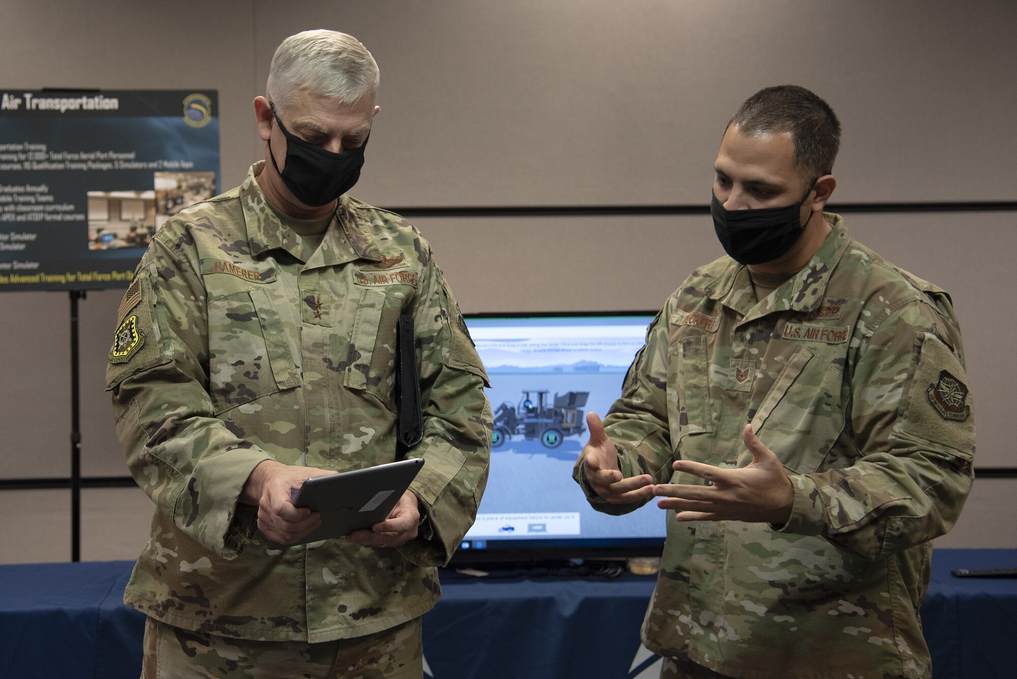 Tech. Sgt. John Decker, Course Director, Air Transportation Instructor Course, 423rd Mobility Training Squadron, explains how Air Transportation and Department of Defense service personnel would utilize the Joint Inspection Simulator and Joint Inspection application for training and qualification to Maj. Gen. Mark Camerer, U.S. Air Force Expeditionary Center commander, during his immersion tour with the U.S. Air Force Expeditionary Operations School at Joint Base McGuire-Dix-Lakehurst, New Jersey on Oct. 19, 2020.  Airmen at the USAF EOS campus explained how they contribute to the USAFEC, Air Mobility Command, and Air Force missions to Camerer who recently took command of the USAF Expeditionary Center. (U.S. Air Force photo by Master Sgt. Ashley Hyatt)
