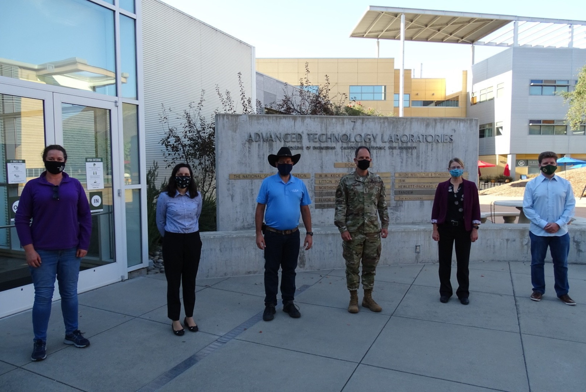 Photo of Maj. Gen. John Shaw meeting Cal Poly CubeSat Lab program students.