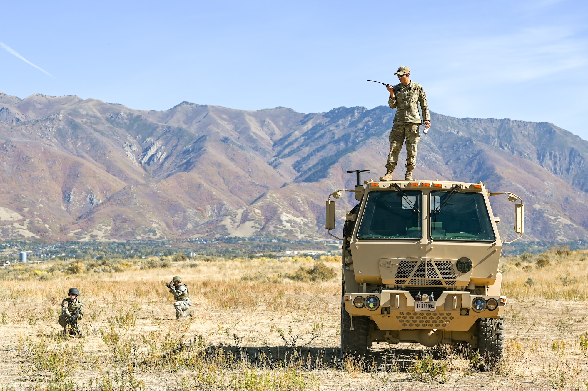 Senior Airman Benjamin Rodriguez, 729th Air Control Squadron, monitors Airmen tactical marching during a Deployment Initial Readiness Training, or DIRT, exercise as part of a simulated defensive scenario Oct. 21, 2020, at Hill Air Force Base, Utah. Airmen from 729th ACS, along with their sister unit 726th ACS from Mountain Home, Idaho, participated in the 48-hour training exercise where they were taught deployment readiness skills. (U.S. Air Force photo by Cynthia Griggs)
