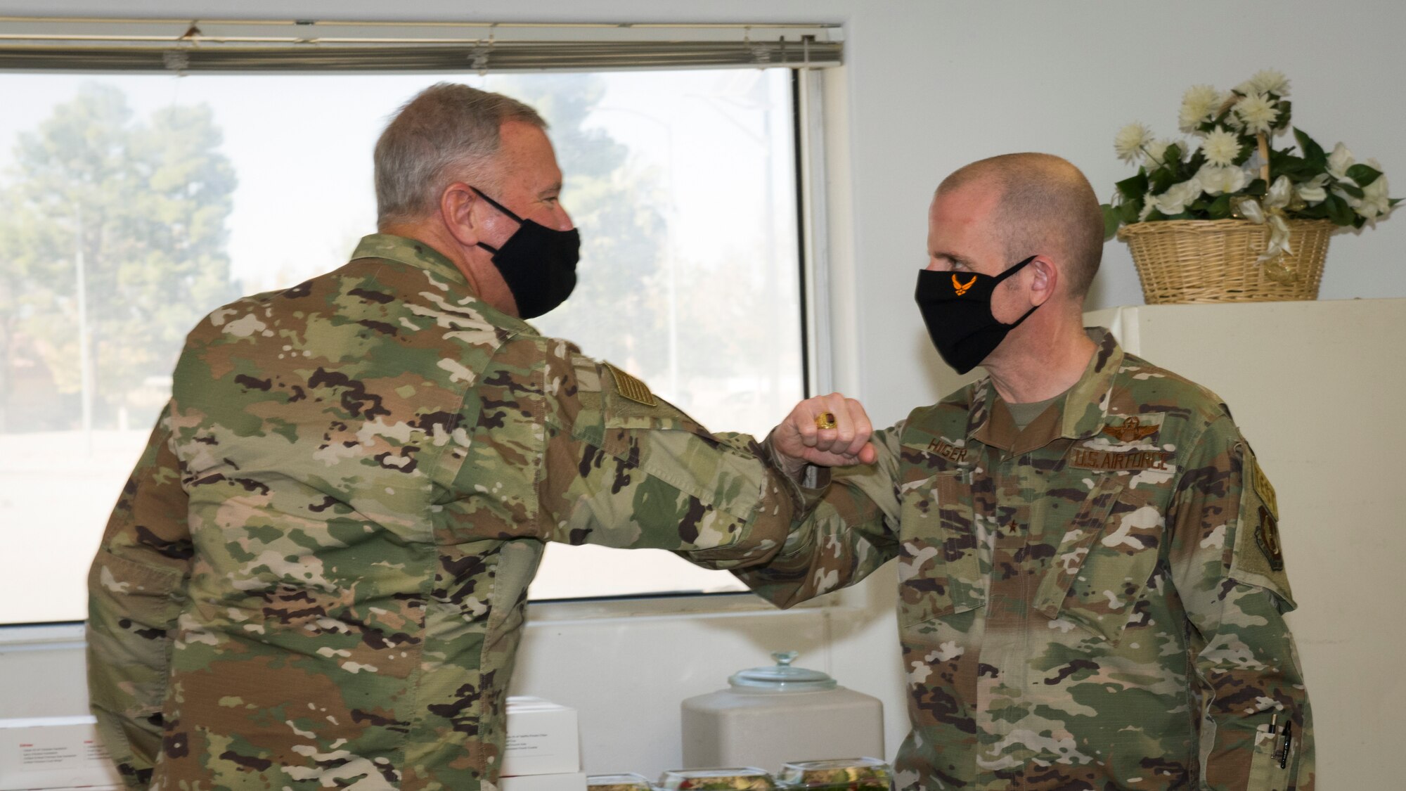 Chaplain (Maj. Gen.) Steven Schaick, Chief of Chaplains, Department of the Air Force, is greeted by Brig. Gen. Matthew Higer, 412th Test Wing Commander, at Edwards Air Force Base, California, Nov. 4. (Air Force photo by Giancarlo Casem)