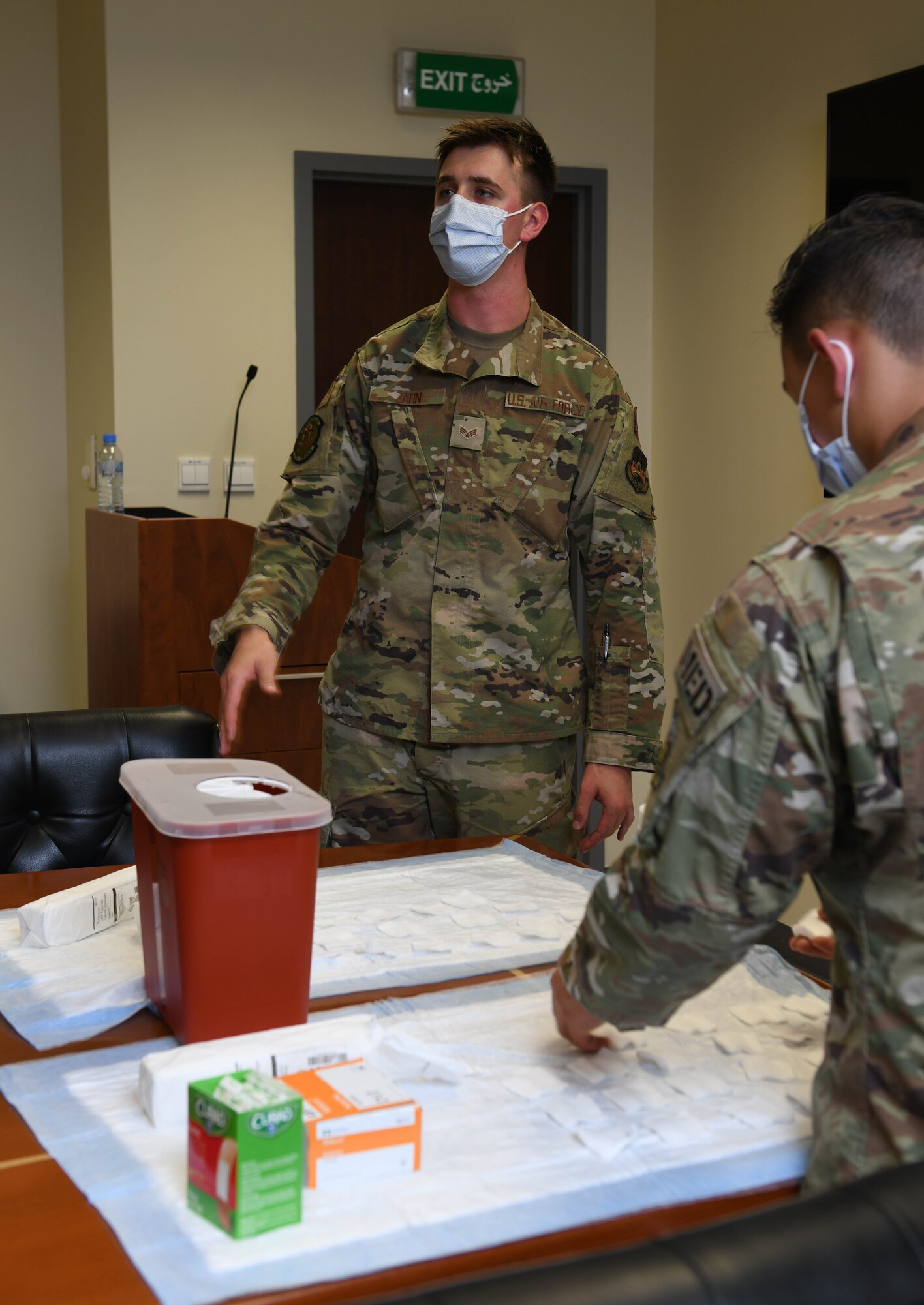 Senior Airman Joshua Zahn and Staff Sgt. Jake Quichocho, medical technicians with the 379th Expeditionary Medical Group, prepare to administer influenza vaccine to Airmen with the 379th Air Expeditionary Wing at Al Udeid Air Base, Qatar, Nov. 3, 2020. Zahn’s initiative to offer vaccination in numerous work centers throughout the wing significantly improves the unit’s mission readiness by preparing service members for the upcoming flu season while preventing confusion between COVID-19 and seasonal flu symptoms. (U.S. Air Force photo by Staff Sgt. Kayla White)
