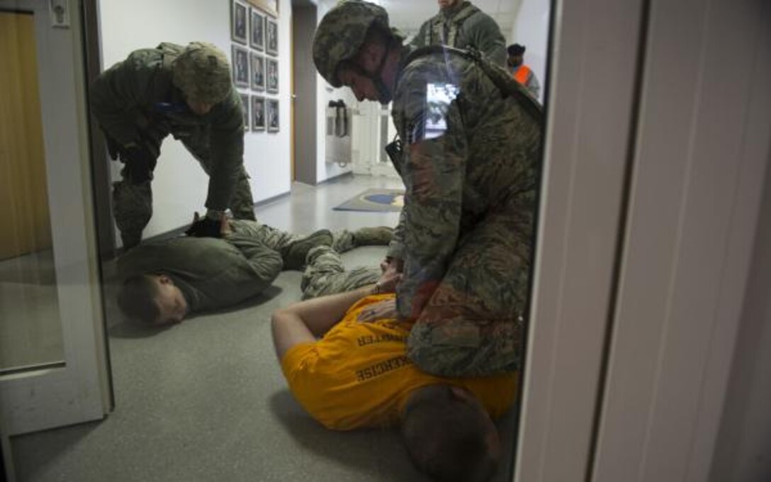 U.S. Air Force Tech. Sgt. Jason Plasner, 52nd Fighter Wing executive assistant to the command chief, acts as an active shooter during an exercise at Spangdahlem Air Base, Germany, Feb. 22, 2017. The realistic scenario involved a disgruntled Airman simulating an active shooter attack on the base. (U.S. Air Force photo by Staff Sgt. Dawn M. Weber)