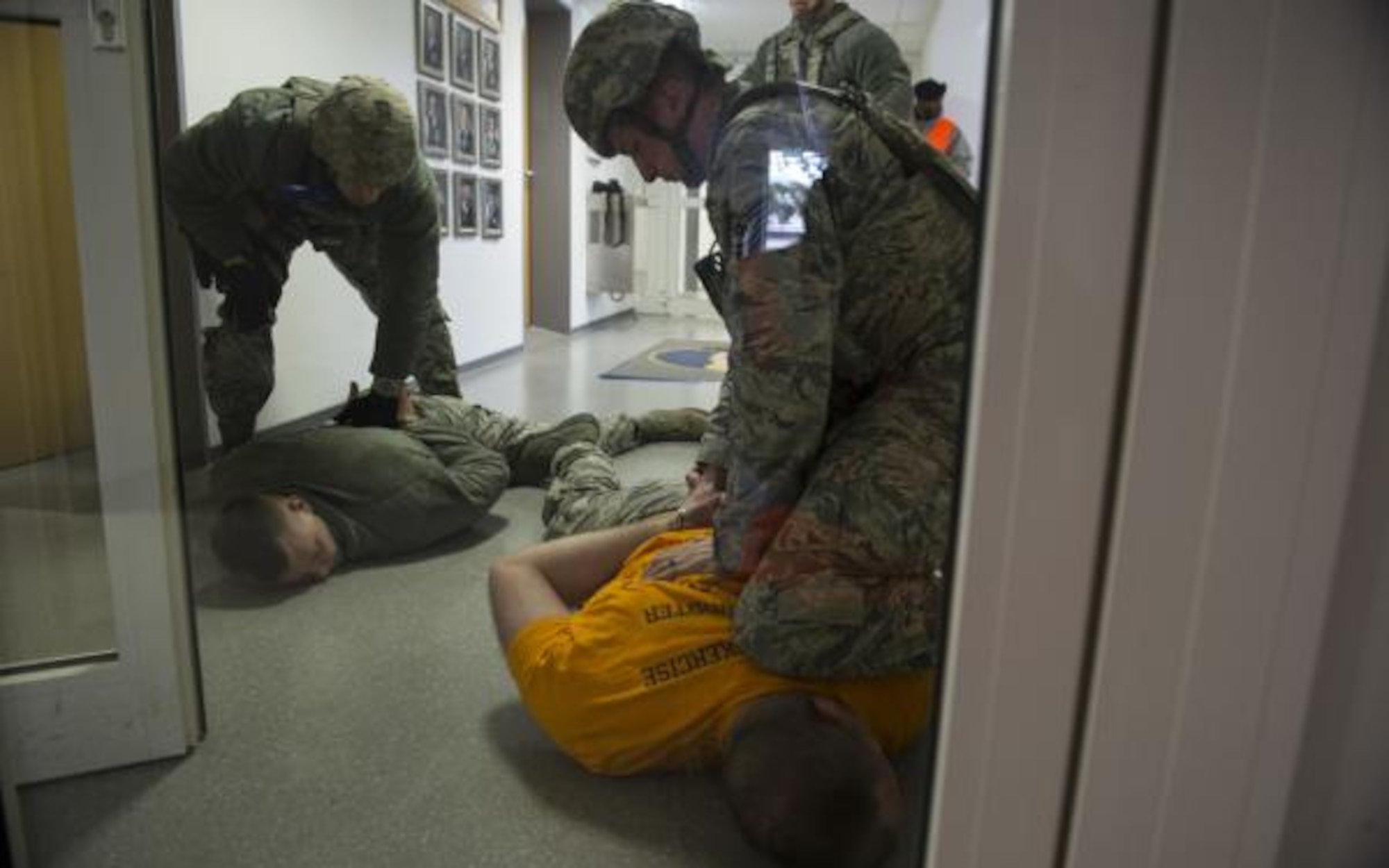 U.S. Air Force Tech. Sgt. Jason Plasner, 52nd Fighter Wing executive assistant to the command chief, acts as an active shooter during an exercise at Spangdahlem Air Base, Germany, Feb. 22, 2017. The realistic scenario involved a disgruntled Airman simulating an active shooter attack on the base. (U.S. Air Force photo by Staff Sgt. Dawn M. Weber)