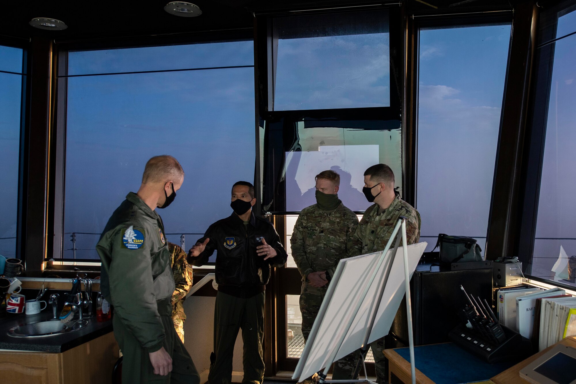 U.S. Air Force Col. Troy Pananon, 100th Air Refueling Wing commander, center, briefs Maj. Gen. Derek France, left, U.S. Air Forces in Europe and Air Forces Africa director of operations, strategic deterrence and nuclear integration, on infrastructure projects at Royal Air Force Mildenhall, England, Nov. 5, 2020. France visited the base to learn about the mission of USAFE - AFAFRICA’s only permanent air refueling wing. (U.S. Air Force photo by Airman 1st Class Joseph Barron)