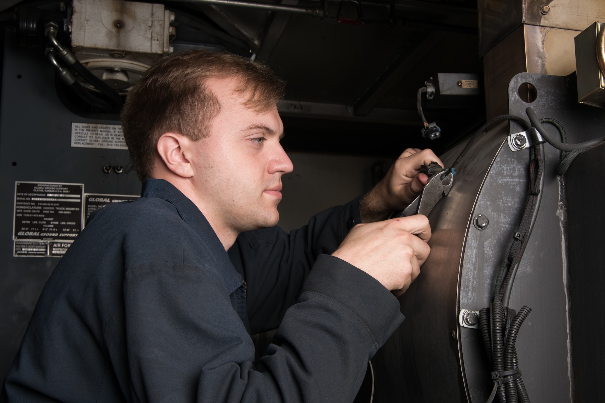Senior Airman Taylor Hall, 436th Logistics Readiness Squadron mission generation vehicle and equipment journeyman, troubleshoots the electrical system on a standard deicer Oct. 22, 2020, at Dover Air Force Base, Delaware.
Hall spearheaded this year’s summer rebuild using his years of cold weather experience to streamline and improve the process and train his team members. (U.S. Air Force photo by Mauricio Campino)