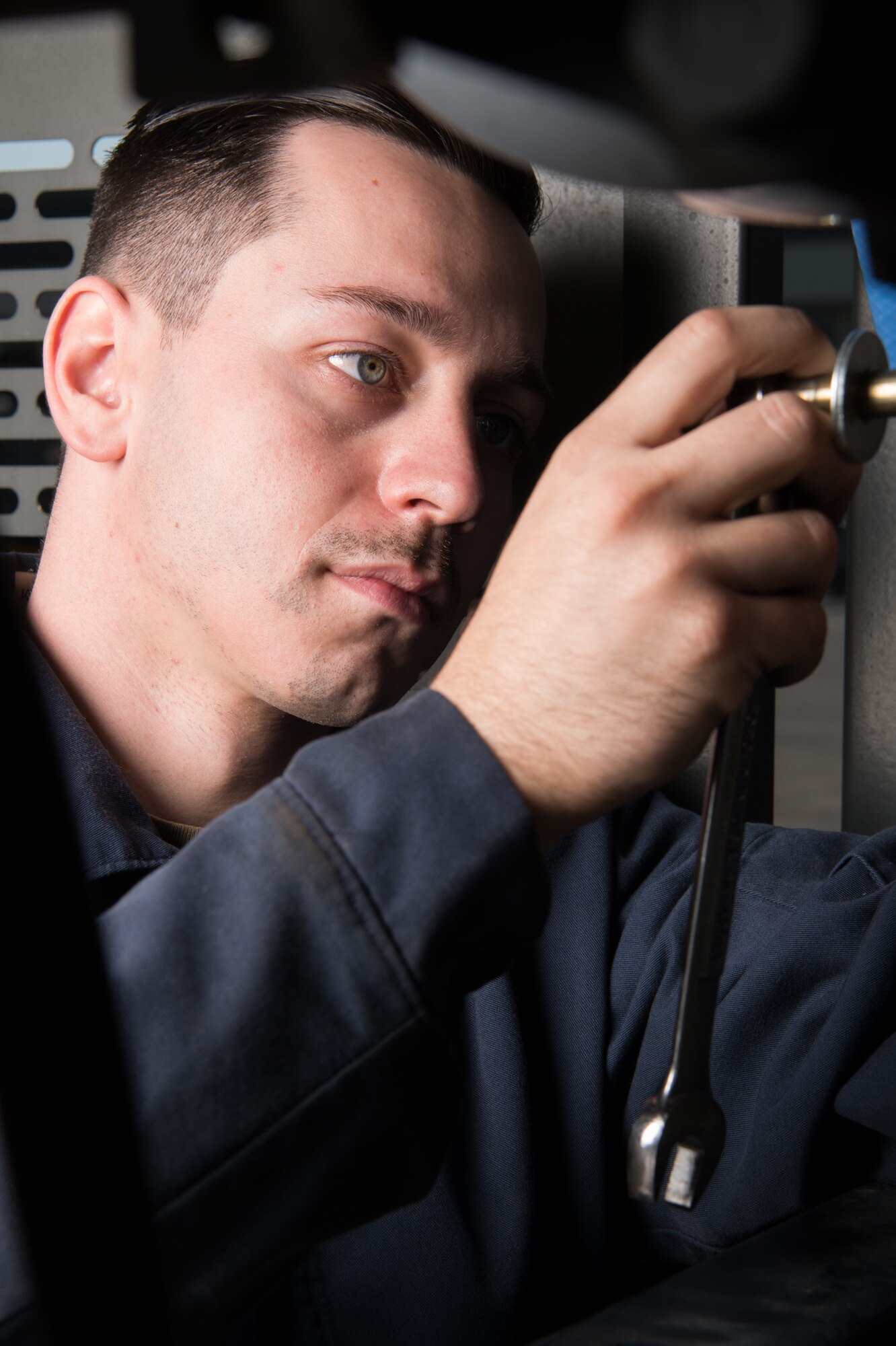 Senior Airman Anthony Rein, 436th Logistics Readiness Squadron mission generation vehicle and equipment journeyman, tightens a hydraulic hose on a standard deicer Oct. 22, 2020, at Dover Air Force Base, Delaware. Ray led his team in maintaining a fleet of 138 vehicles in addition to Dover AFB’s fleet of snow removal vehicles.(U.S. Air Force photo by Mauricio Campino)