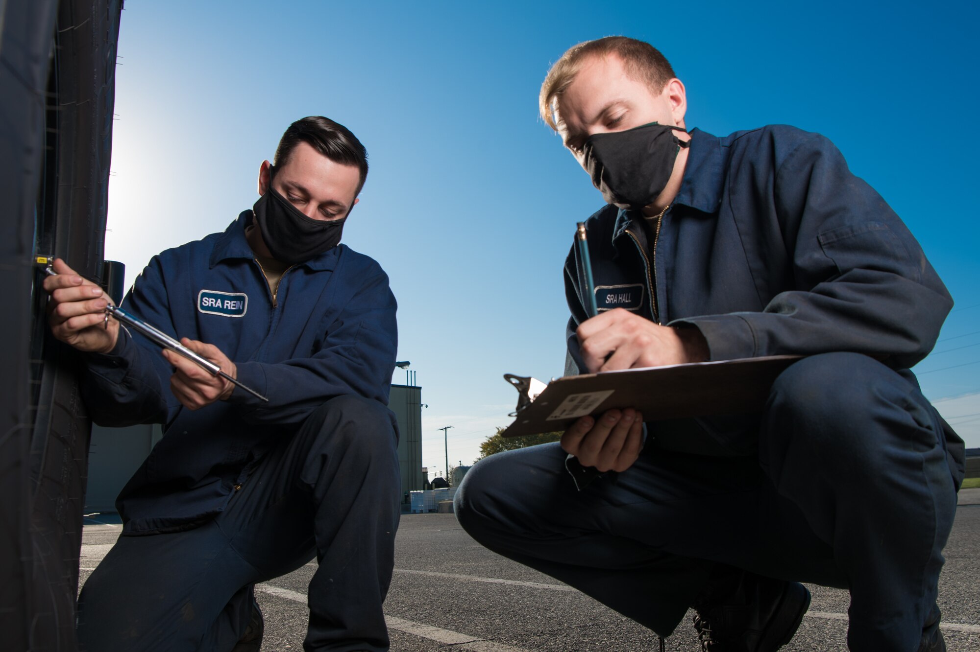 Senior Airman Anthony Rein, 436th Logistics Readiness Squadron mission generation vehicle and equipment journeyman, and Senior Airman Taylor Hall, 436th LRS mission generation vehicle and equipment journeyman, check the tire pressure on a snow plow Oct. 22, 2020, at Dover Air Force Base, Delaware. The 436th LRS replaced a 16-year-old Oskosh runway snow plow by acquiring a used one from Joint Base McGuire-Dix-Lakehurst, New Jersey, saving $30k in repair costs. (U.S. Air Force photo by Mauricio Campino)