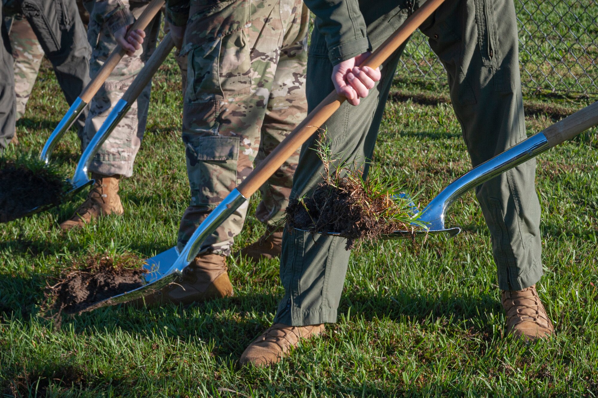 Photo of Airmen using shovels