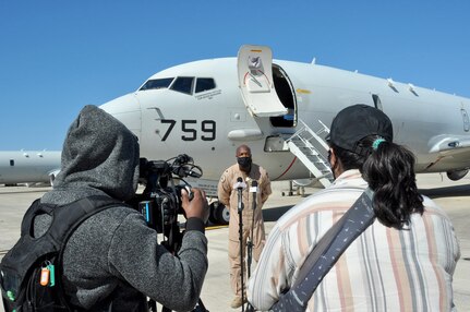 Patrol Squadron 16 Executive Officer Cmdr. Timothy Campbell talks to the local media about the squadron’s mission while deployed to Bahrain after returning home to Naval Air Station Jacksonville, Nov. 2.