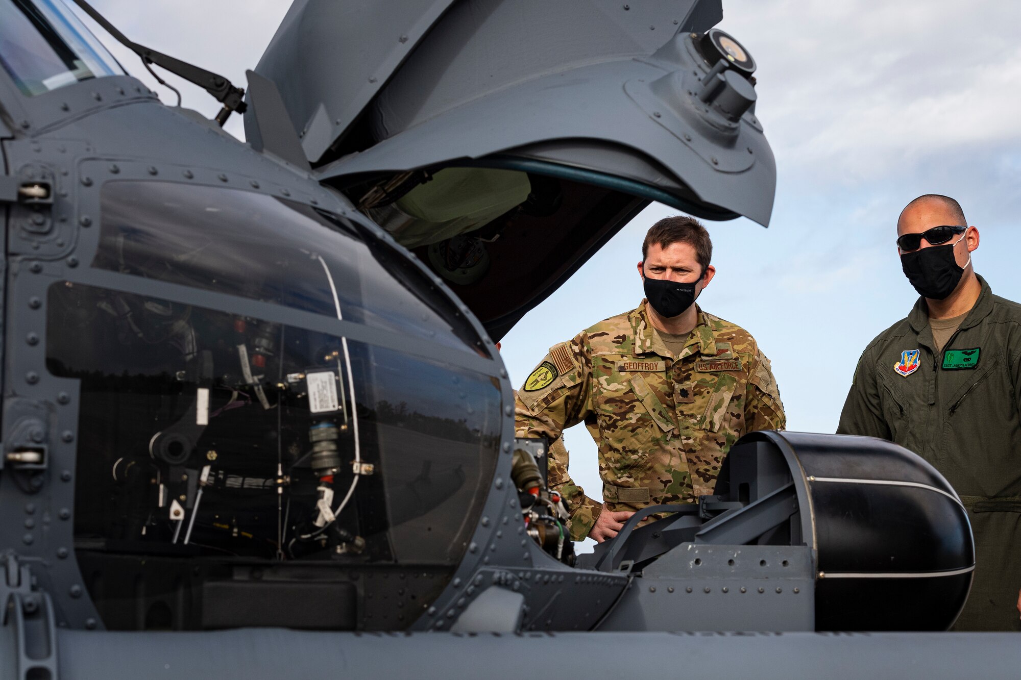 A photo of Airmen inspecting a helicopter