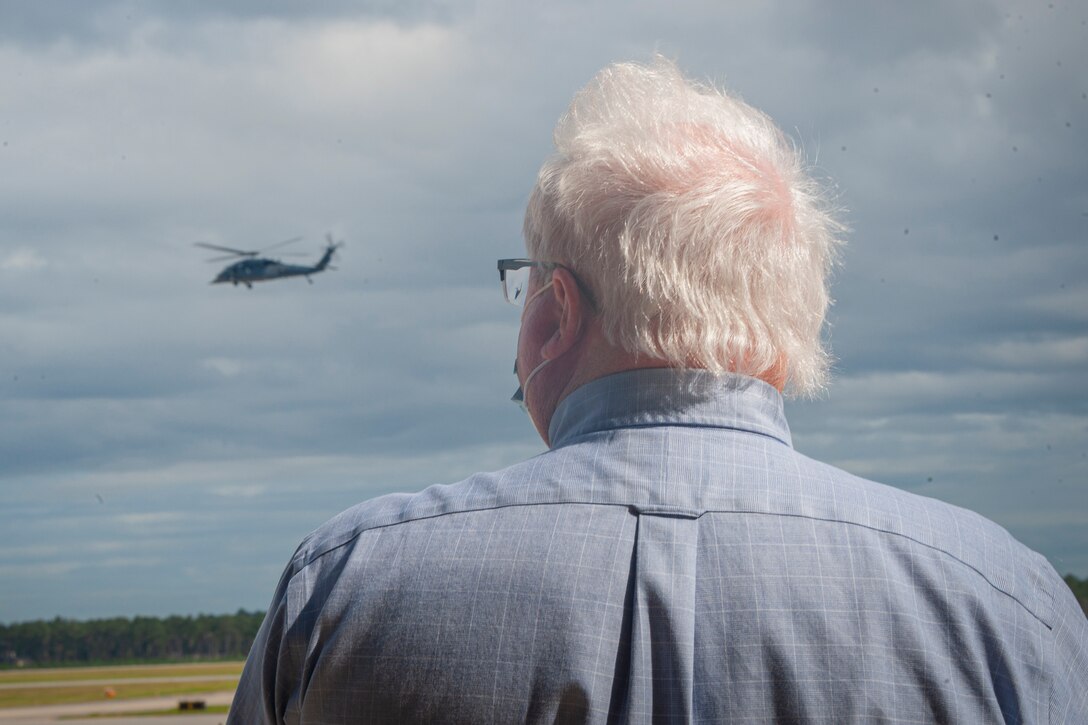 Photo of William Chenault looking at the new HH-60W Jolly Green II