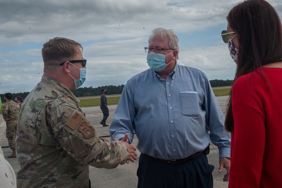 Photo of Chennault family members shaking hands