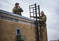 Tech. Sgt. Jeremy Miter, and Capt. Will Boddy, both 274th Air Support Operations Squadron joint terminal attack controllers, control aircraft during Bold Quest 20.2 at Muscatatuck Urban Training Center near Butlerville, Indiana, Oct. 28, 2020. Led by the Joint Staff, Bold Quest is multinational training that demonstrates a joint capability to link sensors to shooters across air, land, sea, space and cyberspace.