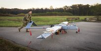 U.S. Army Spc. Christopher Cardwell, Delta Company, 776th Brigade Engineer Battalion, Detachment 1, Unmanned Aircraft Systems maintainer, prepares a RQ-7B Shadow for flight during Bold Quest 20.2 at Camp Atterbury, Indiana, Oct. 30, 2020. Bold Quest is a collaborative joint and multinational enterprise in which Nations, Services and Programs pool their resources in a recurring cycle of capability development, demonstration and analysis. Conceived in 2001, the BQ coalition has grown since 2003 from the U.S. services and four nations to now include 18 Partner Nations and NATO Headquarters.