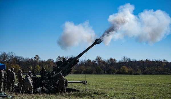 Soldiers with the Indiana Army National Guard conduct a field artillery fire mission during Exercise Bold Quest 20.2 at Camp Atterbury, Indiana, Oct. 31, 2020. Led by the Joint Staff, Bold Quest is a multinational training demonstration to test a joint capability to link sensors to shooters across air, land, sea, space and cyberspace.