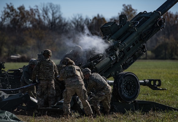 Soldiers with the Indiana Army National Guard conduct a field artillery fire mission during Exercise Bold Quest 20.2 at Camp Atterbury, Indiana, Oct. 31, 2020. Led by the Joint Staff, Bold Quest is a multinational training demonstration to test a joint capability to link sensors to shooters across air, land, sea, space and cyberspace.