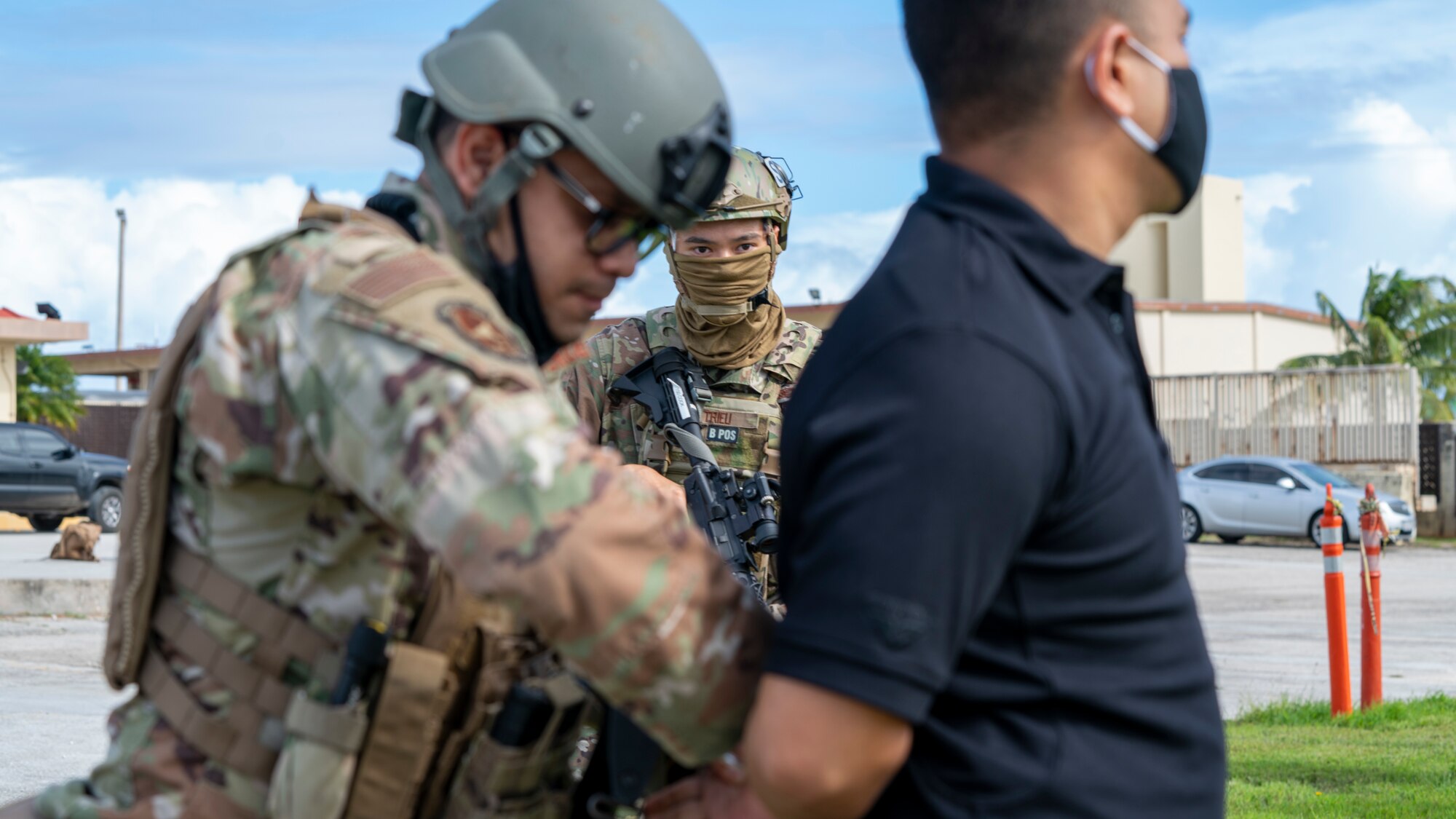 Members of the 736th Security Forces Squadron practice handcuffing a suspect during a flightline attack scenario as part of Exercise Sling Stone 21-1 on Nov. 5, 2020 at Andersen Air Force Base, Guam. Exercise Sling Stone is an annual anti-terrorism force protection exercise. The exercise involved multiple training scenarios intended to prepare service members to respond to emergency situations. (U.S. Air Force photo by Tech. Sgt. Esteban Esquivel)