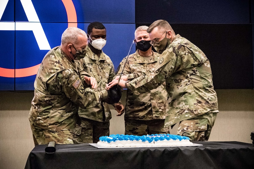 Lt. Gen. Terry Ferrell, U.S. Army Central commanding general and Command Sgt. Maj. Brian Hester, USARCENT senior enlisted adviser, are joined by the command's youngest and oldest Soldier for USARCENT's 102nd birthday cake cutting at the command's headquarters on Shaw Air Force Base, S.C., Nov.6, 2020.