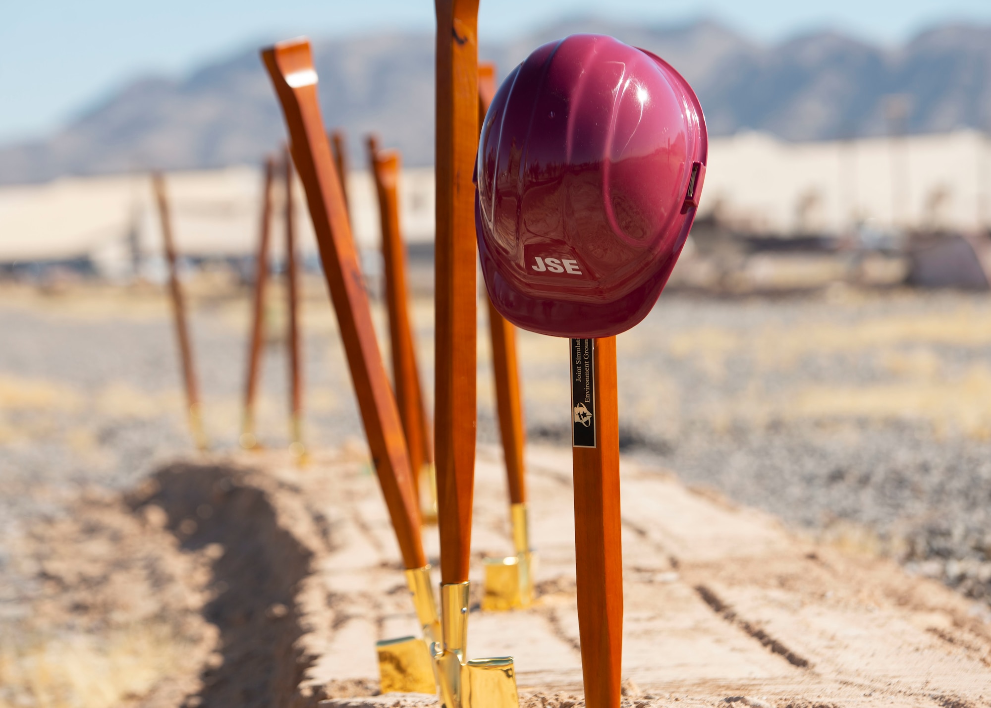Photos of helmets and shovels for the JSE Groundbreaking Ceremony
