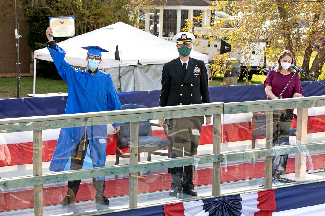 Rigger Apprentice Graduate Matthew Bricker shows off his Technician Career Studies Certificate at the Norfolk Naval Shipyard Apprentice Graduation Nov. 6 at Scott Center Annex in Portsmouth, Va.