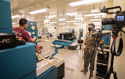Jeremy Gray, a maintainer with Marine Depot Maintenance Command’s (MDMC) Calibration Contract Team (CCT), demonstrates proper machine calibration as part of a virtual instruction video program for Marines with 3d Maintenance Battalion