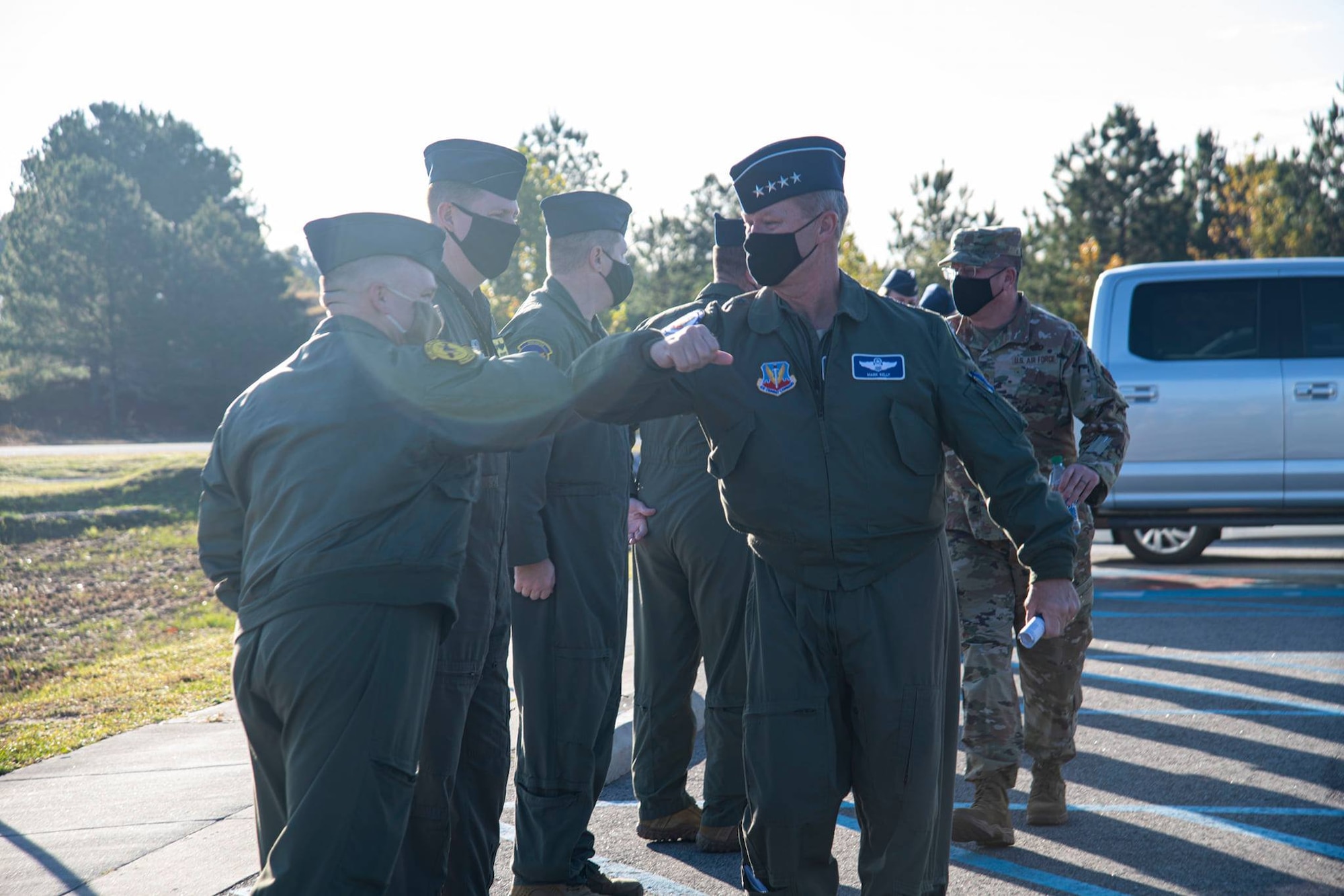 A photo of Airmen greeting a General.