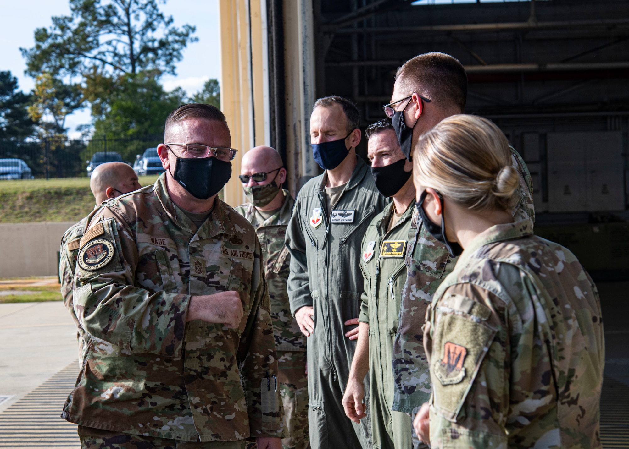 A photo of Airmen interacting with a command chief.