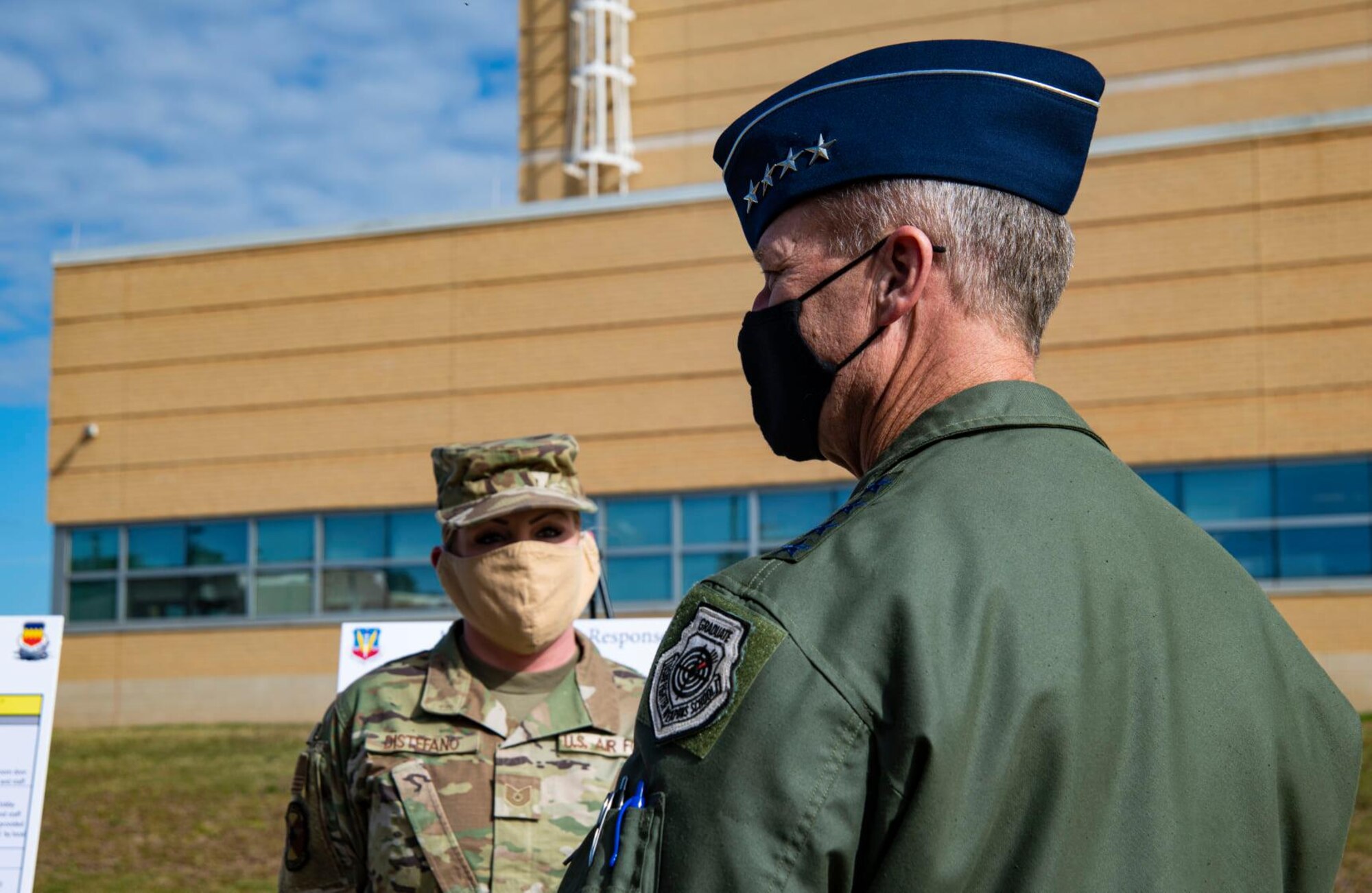 A photo of a General and an Airman.