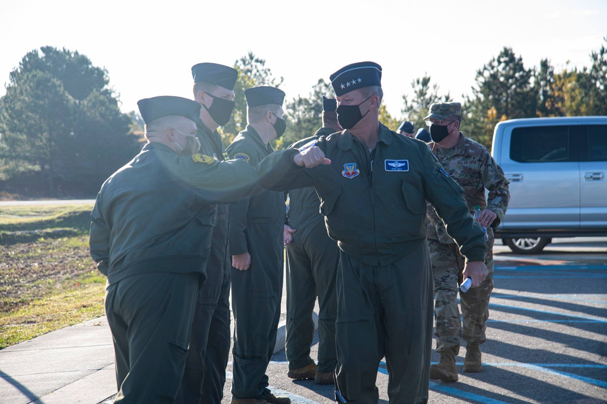 A photo of Airmen greeting a General.