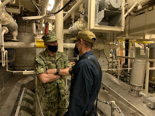 Vice Chief of Naval Operations (VCNO) Adm. Bill Lescher talks with Engineman 1st Class Lee Holts during a tour of the Freedom-variant littoral combat ship USS St. Louis (LCS 19).