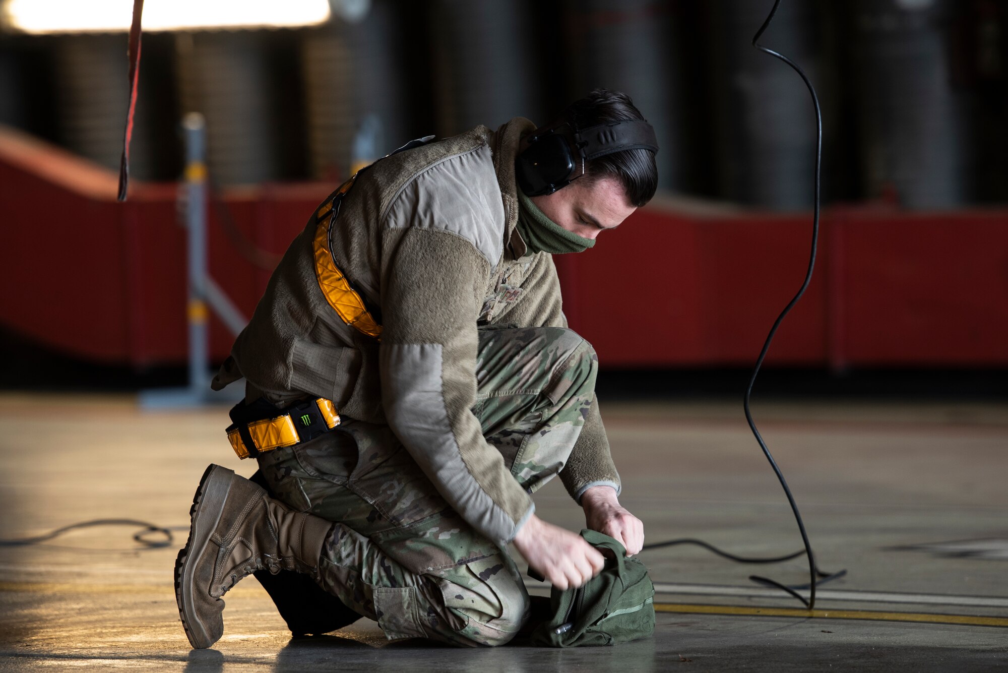 U.S. Air Force Senior Airman Dylan Tyler, 748th Aircraft Maintenance Squadron weapons load crew member, performs pre-flight checks on an F-15C Eagle prior to take-offs in support of exercise Crimson Warrior at Royal Air Force Lakenheath, England, Nov. 4, 2020. Multi-domain integration exercises like Crimson Warrior strengthen NATO interoperability and test high-end capabilities in a contested, degraded, and operationally limited environment. (U.S. Air Force photo by Airman 1st Class Jessi Monte)