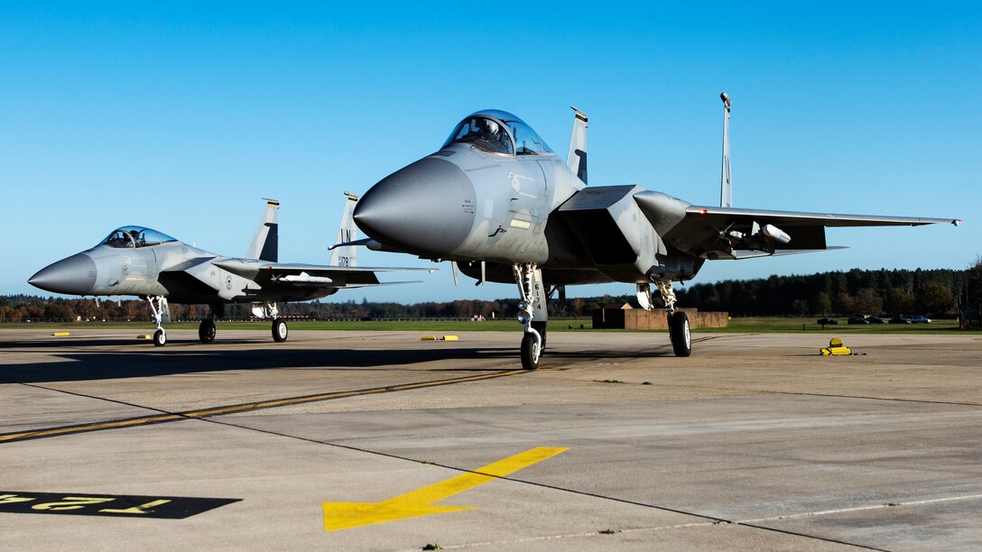 F-15C Eagles assigned to the 493rd Fighter Squadron await clearance for  take off in support of exercise Crimson Warrior at Royal Air Force Lakenheath, England, Nov. 4, 2020. Multi-domain integration exercises like Crimson Warrior strengthen NATO interoperability and test high-end capabilities in a contested, degraded, and operationally limited environment. (U.S. Air Force photo by Airman 1st Class Jessi Monte)