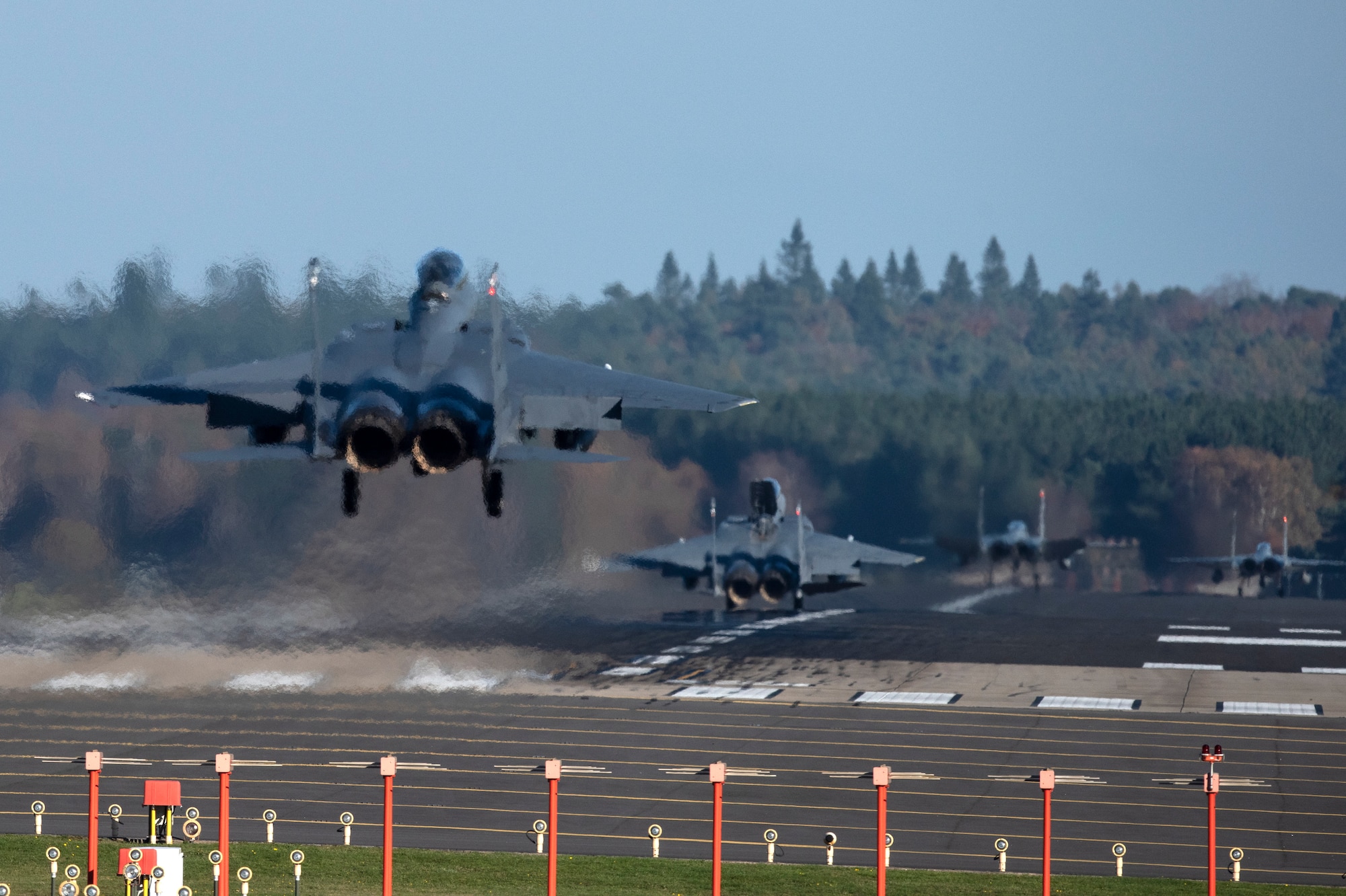 F-15E Strike Eagles and F-15C Eagles assigned to the 48th Fighter Wing land after completion of a training sortie in support of exercise Crimson Warrior at Royal Air Force Lakenheath, England, Nov. 6, 2020. Multi-domain integration exercises like Crimson Warrior strengthen NATO interoperability and test high-end capabilities in a contested, degraded, and operationally limited environment. (U.S. Air Force photo by Airman 1st Class Jessi Monte)