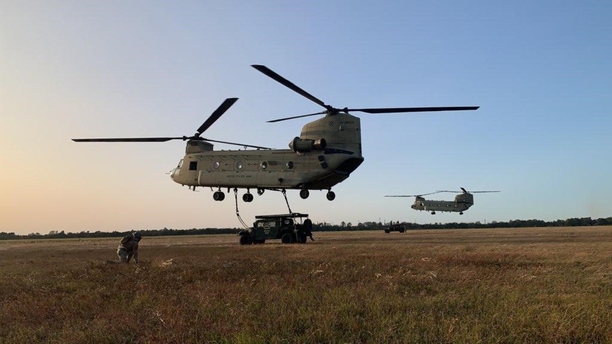 Airmen from the 621st Contingency Response Squadron together with Soldiers from the 3rd Combat Aviation Brigade out of Fort Stewart-Hunter Army Airfield, Georgia, trained on simultaneously sling loading two HMMWVS on CH-47 Chinook helicopters during Exercise Guardian Shield, which was held Nov. 2-6 at the North Auxiliary Airfield near Joint Base Charleston, South Carolina.(courtesy photo)