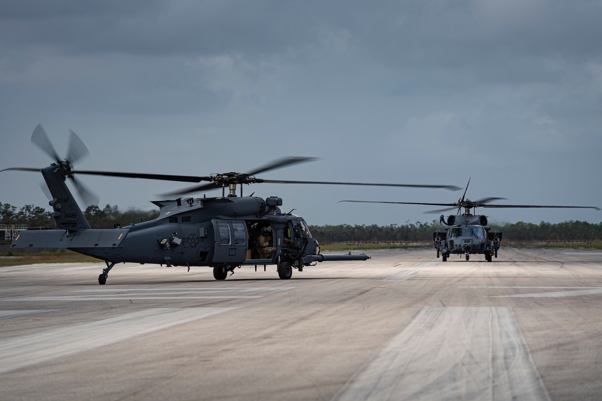 A photo of helicopters preparing for takeoff